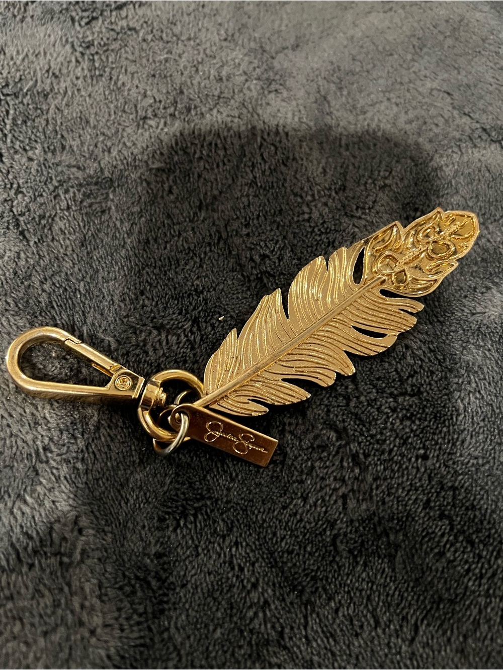 Jessica Simpson gold feather bag charm